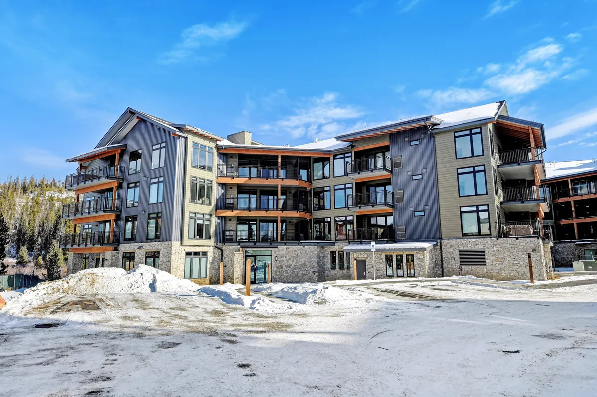 This exterior image spotlights the modern architectural style of the property, with large windows and wooden balconies overlooking snowy ground. The setting evokes winter coziness and sets the scene for après-ski relaxation and memorable outdoor gatherings.